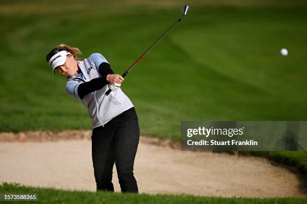 Brooke M. Henderson of Canada plays her second shot out of the bunker on the 11th hole during the first round of the Amundi Evian Championship at...