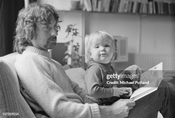 British drummer Nick Mason, of rock group Pink Floyd, with one of his daughters, 12th October 1972.