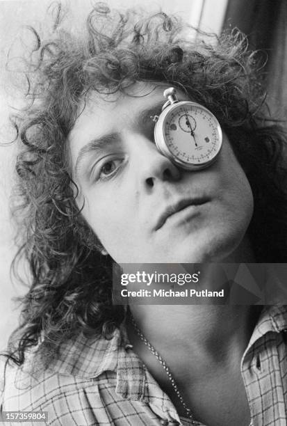 Singer Marc Bolan of British glam rock group T-Rex, poses with a stopwatch over one eye at the Chateau d'Herouville recording studio, France, 23rd...