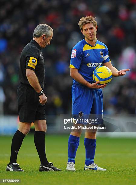 Stacy Long of AFC Wimbledon talks to referee Scott Mathieson during the FA Cup with Budweiser Second Round match between MK Dons and AFC Wimbledon at...