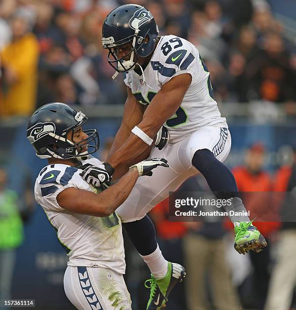 Doug Baldwin of the Seattle Seahawks celebrates with Golden Tate after Tate caught the go-ahead touchdown pass in the 4th quarter against the Chicago...