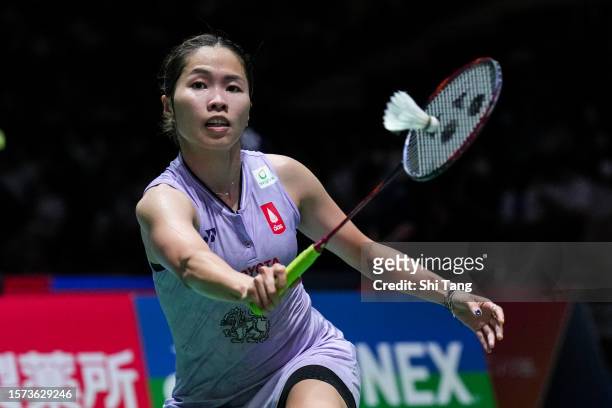 Ratchanok Intanon of Thailand competes in the Women's Singles Second Round match against Supanida Katethong of Thailand on day three of the Japan...