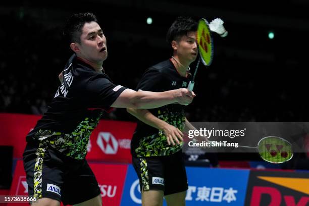 Takuro Hoki and Yugo Kobayashi of Japan compete in the Men's Doubles Second Round match against Ren Xiangyu and Tan Qiang of China on day three of...
