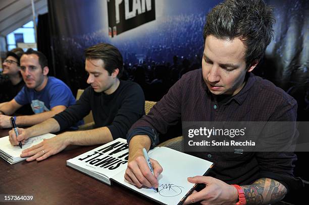 Musicians Chuck Comeau, Sebastien Lefebvre and Pierre Bouvier attend "Simple Plan: The Official Story" book signing at Chapters Indigo on November...