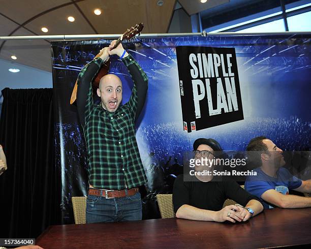 Musicians Jeff Stinco and David Desrosiers attend "Simple Plan: The Official Story" book signing at Chapters Indigo on November 29, 2012 in Toronto,...