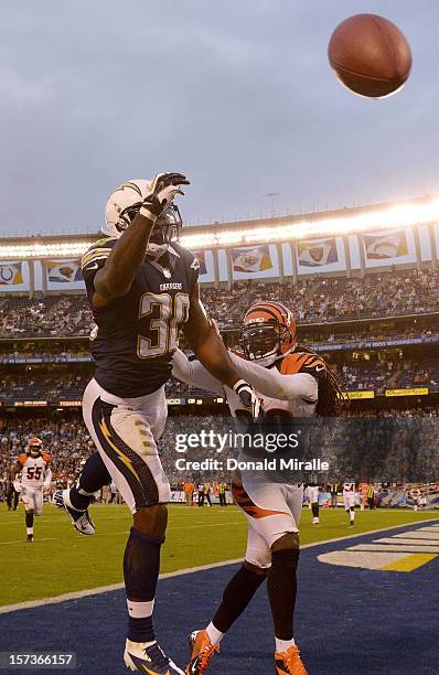 Ronnie Brown of the San Diego Chargers misses a catch against Reggie Nelson of the Cincinnati Bengals on December 2, 2012 at Qualcomm Stadium in San...