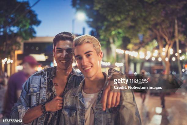 gay couple enjoying a lovely night out in buenos aires - buenos aires night stock pictures, royalty-free photos & images