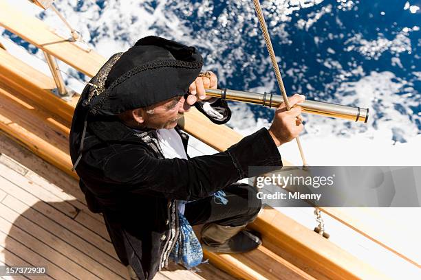 pirate captain hunting - day telescope stock pictures, royalty-free photos & images