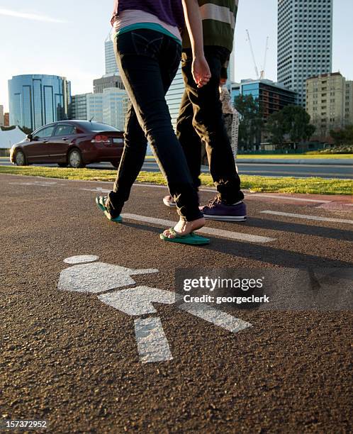 young city pedestrians - pedestrian path stock pictures, royalty-free photos & images