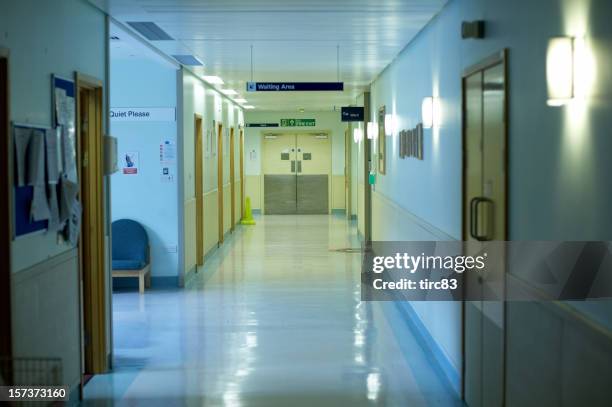 hospital corridor blue walls - nhs hospital stock pictures, royalty-free photos & images