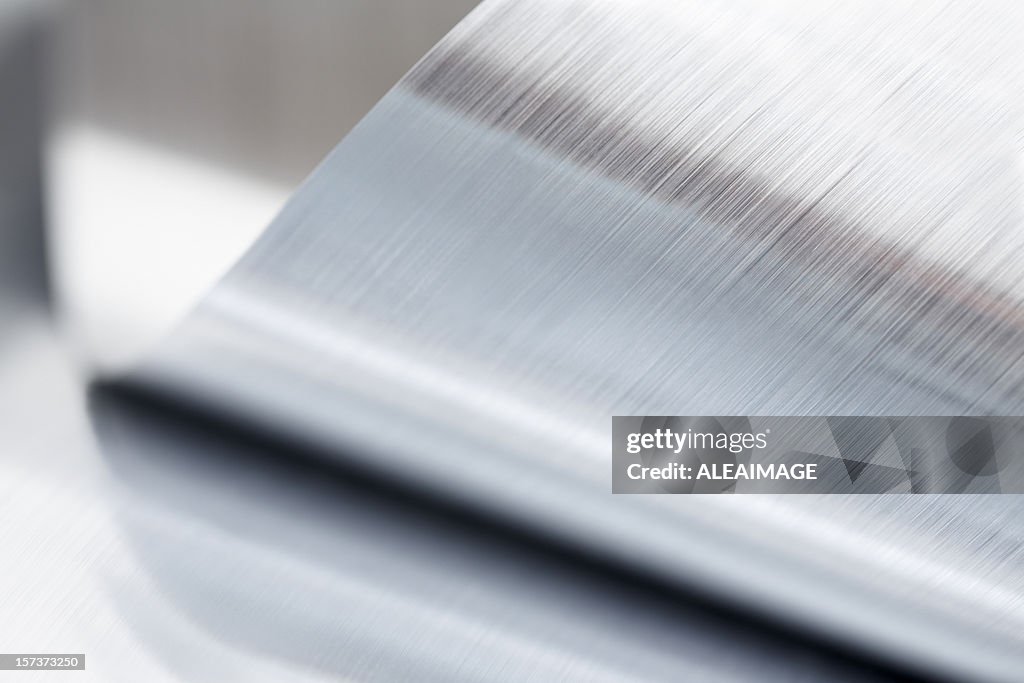 Close-up of a metallic sheet that is rolled up