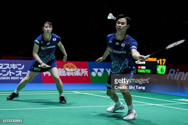 Yuta Watanabe and Arisa Higashino of Japan compete in the Mixed Doubles Second Round match against Tang Chun Man and Tse Ying Suet of Hong Kong on...