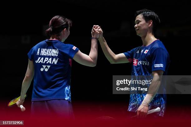 Yuta Watanabe and Arisa Higashino of Japan celebrate the victory in the Mixed Doubles Second Round match against Tang Chun Man and Tse Ying Suet of...