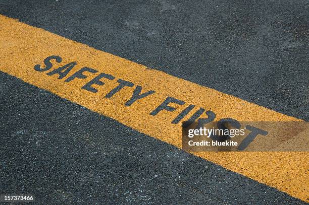 please stand behide the yellow line! - trip hazard sign stock pictures, royalty-free photos & images