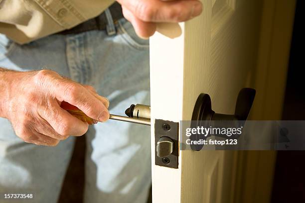 home improvements replacing door knob - lock stock pictures, royalty-free photos & images