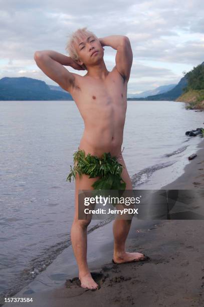 island boy at sunset - loin cloth stockfoto's en -beelden