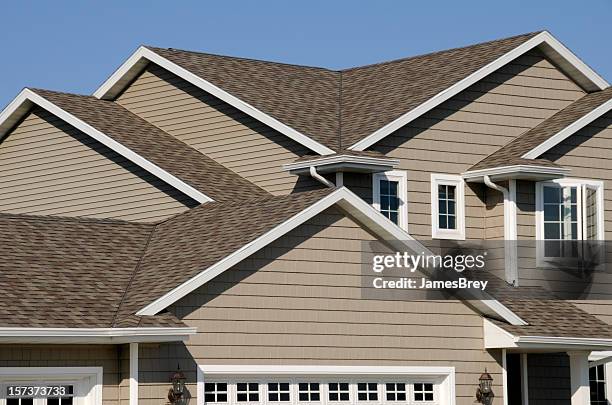 new residential house; architectural asphalt shingle gable roof, vinyl siding - wood shingle stock pictures, royalty-free photos & images