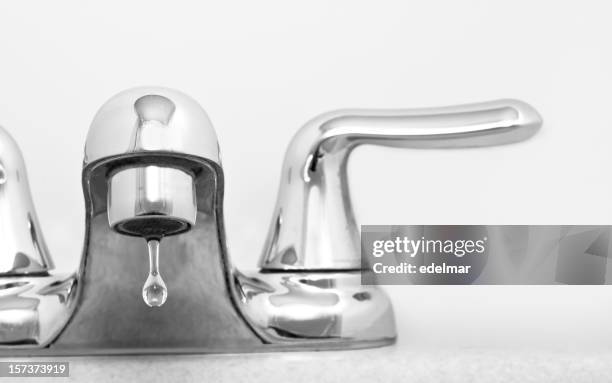 close up of stainless steel faucet dripping water - faucet 個照片及圖片檔