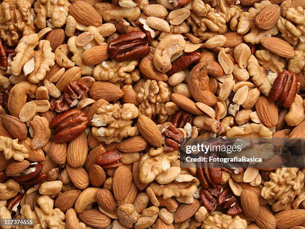 nuts background - pecan walnut stock pictures, royalty-free photos & images