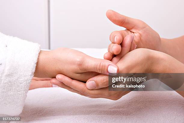 hand massage - hand massage stock pictures, royalty-free photos & images