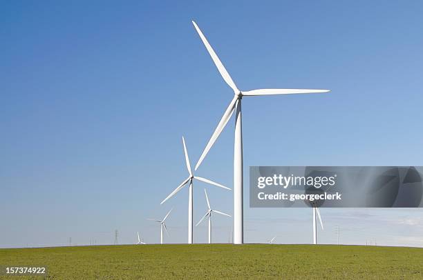 clean green wind energy - windmill stock pictures, royalty-free photos & images