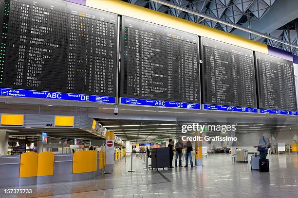 airport with arrival departure board - airport frankfurt stock pictures, royalty-free photos & images