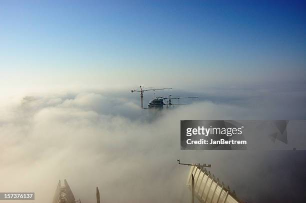building in the fog - dubai fog stock pictures, royalty-free photos & images