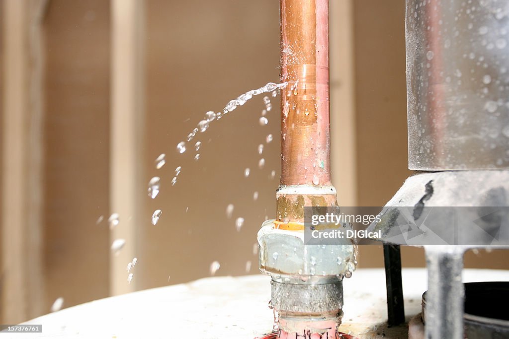 Close-up of drain pipe leaking water