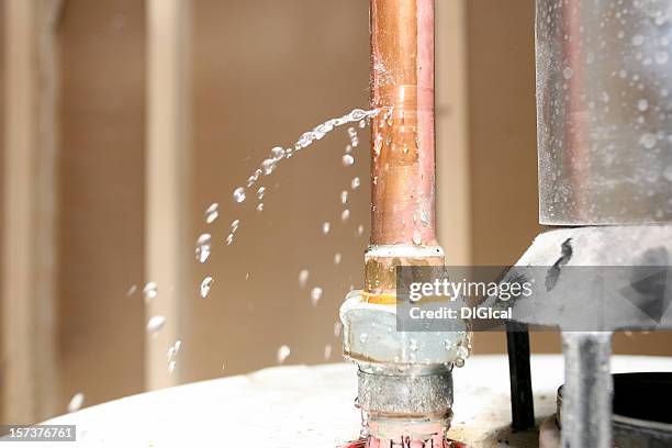 close-up of drain pipe leaking water - water pipe stock pictures, royalty-free photos & images