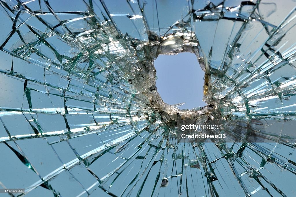 Car windshield shattered by a bullet
