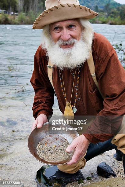 miner with gold pan - gold panning stock pictures, royalty-free photos & images