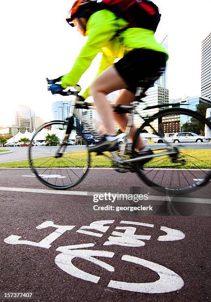 cycling to work - bicycle lane stock pictures, royalty-free photos & images