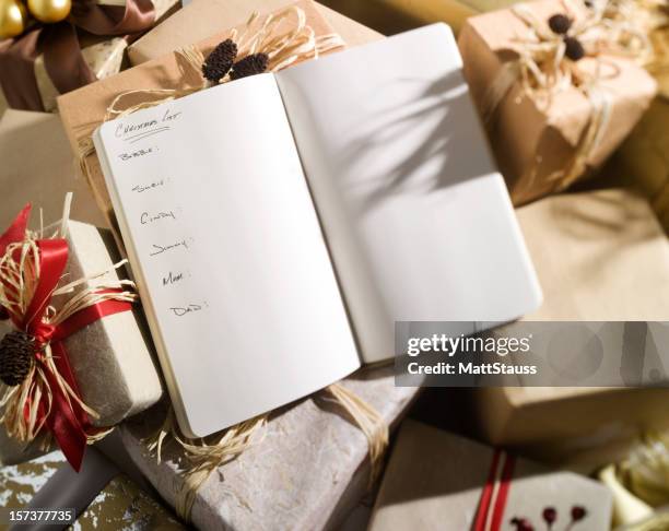 christmas list with names..... - shopping list stock pictures, royalty-free photos & images