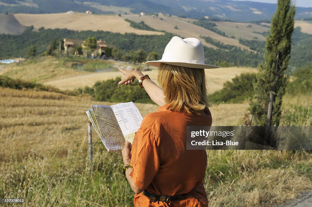 Woman with Map Looking for Country Inn