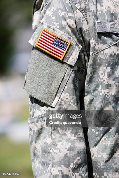 american flag badge on army soldier uniform, copy space - military badge stock pictures, royalty-free photos & images
