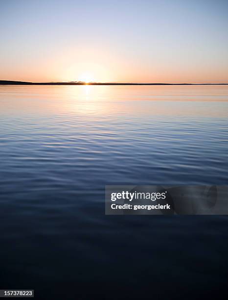 tranquil sunset over calm water - monkey mia stock pictures, royalty-free photos & images