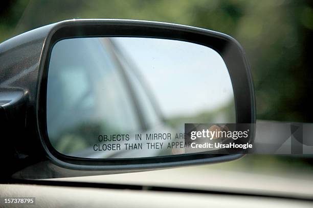 close-up of car mirror objects are closer than they appear - mirror object stock pictures, royalty-free photos & images