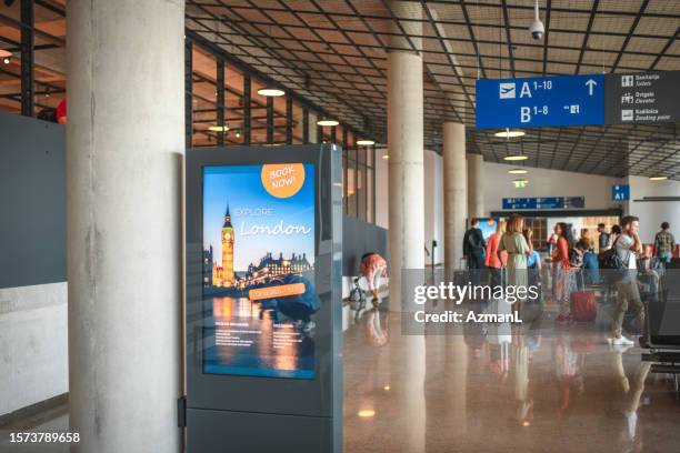 digital poster mock up at the airport departures terminal - airport mockup stock pictures, royalty-free photos & images