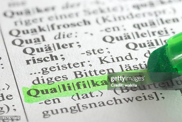 qualification highlighted in dictionary in dictionary - german culture stock pictures, royalty-free photos & images