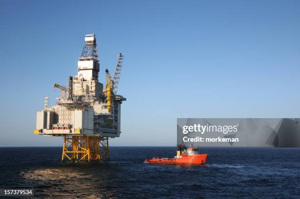 platform and boat - north sea stock pictures, royalty-free photos & images