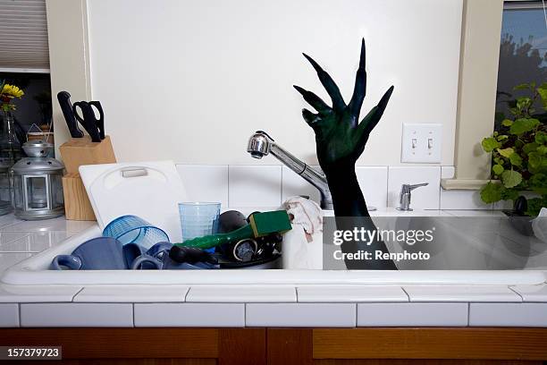 monster hand series: kitchen sink - hand claw stock pictures, royalty-free photos & images