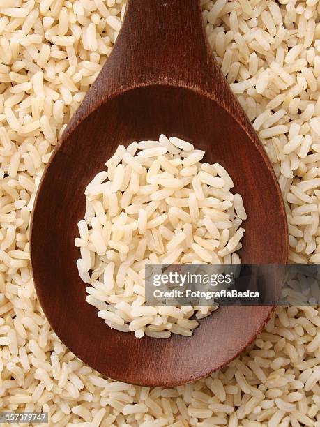 boiled brown rice - brown rice stock pictures, royalty-free photos & images