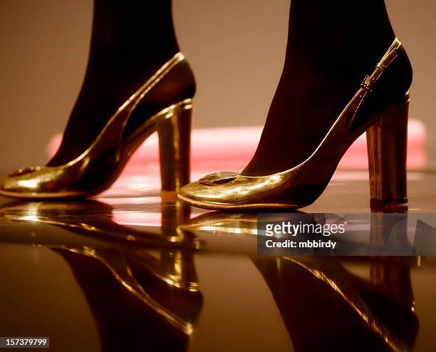 modern shoes - golden shoes stock pictures, royalty-free photos & images