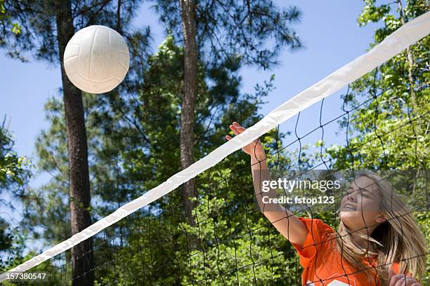 teenagers playing volleyball in the summer - girls volleyball stock pictures, royalty-free photos & images