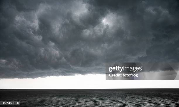 dramatic clouds - squall stock pictures, royalty-free photos & images