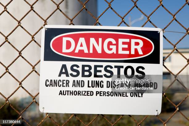 danger asbestos warning sign - asbestos stock pictures, royalty-free photos & images