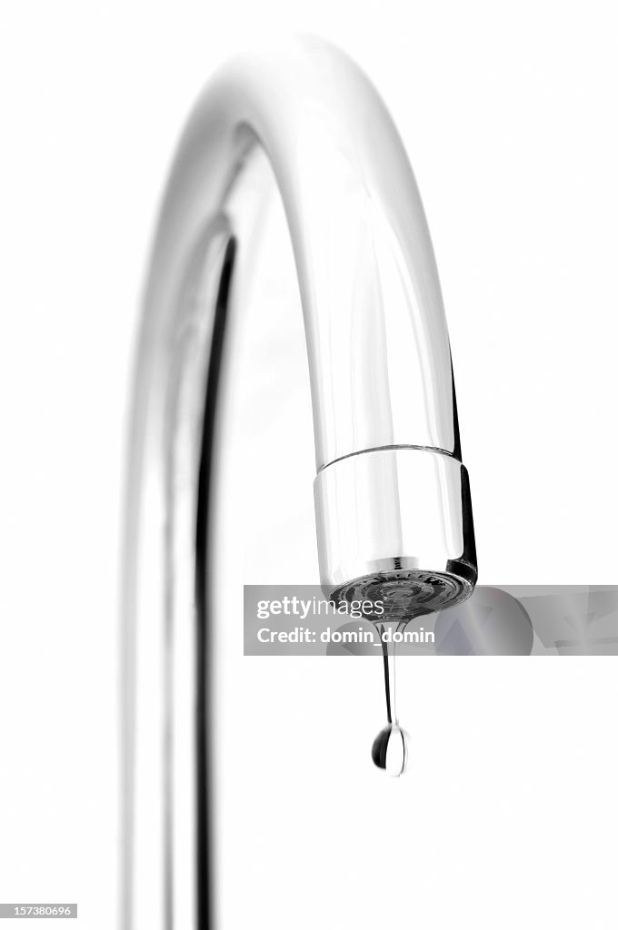 Kitchen water tap with coming out drop, isolated on white