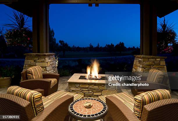 fire pit deck at night - fire pit stock pictures, royalty-free photos & images