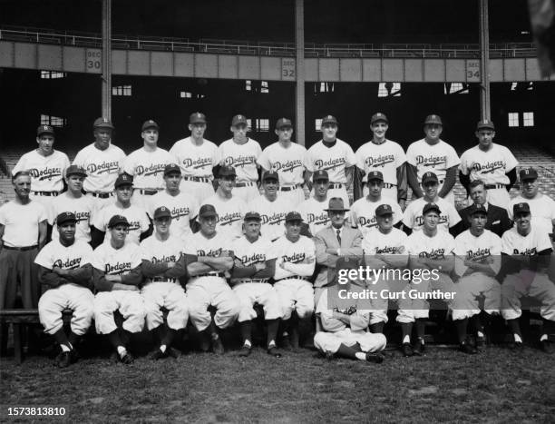 Front row, left to right: Roy Campanella, Marv Rackley, Carl Erskine, bullpen catcher Gus Narron, Coach Jake Pitler, Coach Clyde Sukeforth, Manager...