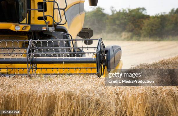 "harvest" - landwirtschaftliche maschine stock-fotos und bilder